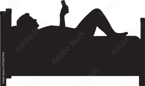 Silhouette of person lying in bed using smartphone