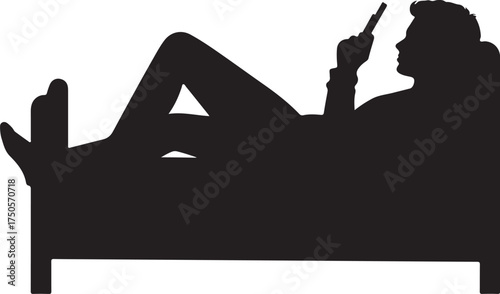 Silhouette of person reclining on sofa using mobile phone