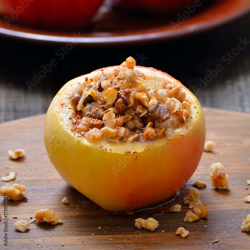 Baked apple stuffed with nut, honey and granola