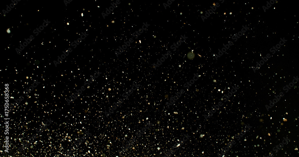 Obraz premium Detailed wave of airborne clay dust swirling in chaotic motion, captured in freeze motion. Dramatic natural explosion of earthy particles on black background.