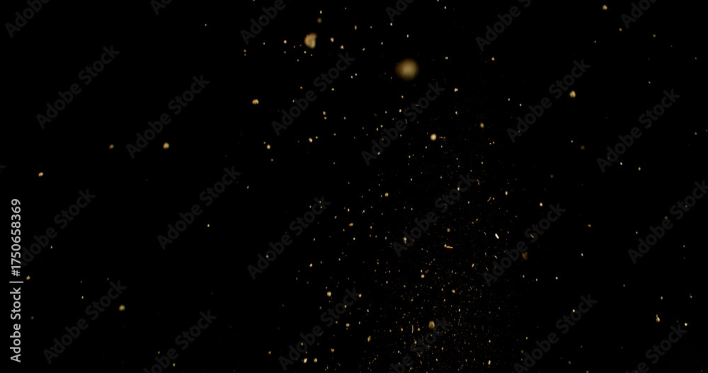Obraz premium Detailed wave of airborne clay dust swirling in chaotic motion, captured in freeze motion. Dramatic natural explosion of earthy particles on black background.