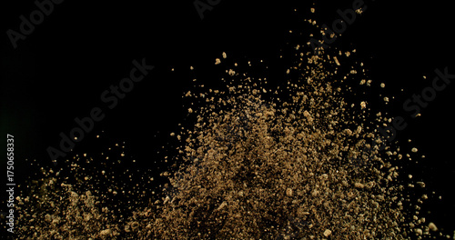 Powerful burst of clay particles exploding upward in a dense cloud, isolated on black. High-speed photography capturing the dynamic texture of dry earth in motion.