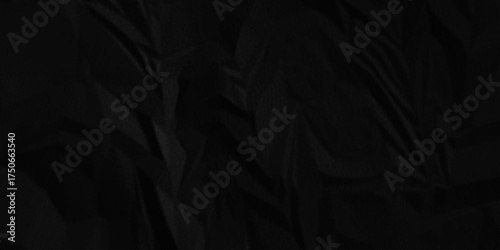 Black crumpled paper texture. Black wrinkled paper texture. Black paper texture. Black crumpled and top view textures can be used for background of text or any contents .