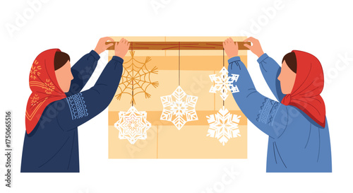 Two people hang paper snowflakes on a wall celebrating winter crafts