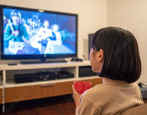 young woman watching tv