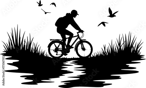 silhouette of a man riding a bicycle