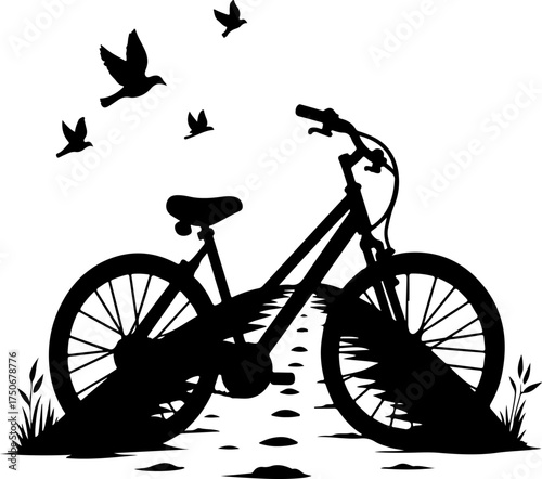 silhouette of a man riding a bicycle