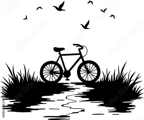 silhouette of a man riding a bicycle
