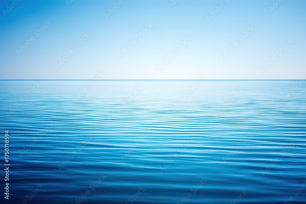 Obraz premium Expansive ocean horizon blending tranquil azure shades with subtle ripples creating a peaceful ambiance that captures the essence of calmness and serenity in a minimalist seascape