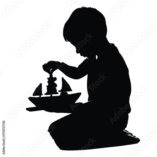 Silhouette of a young child kneeling and playing with a toy boat against a white background