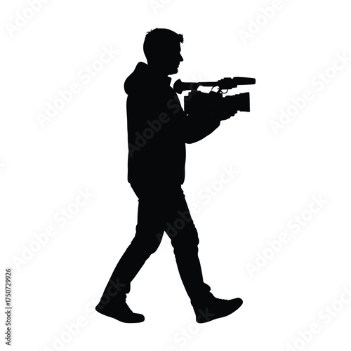 A silhouette of a man walking while carrying a video camera on his shoulder isolated on white