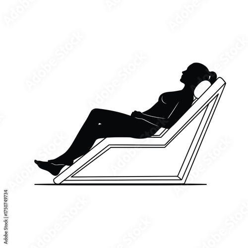 Silhouette of a woman reclining on a modern deck chair with a pillow in a black and white image