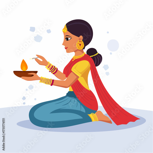 A beautiful Indian woman in traditional attire kneeling and holding a lit diya oil lamp for a ceremony.
