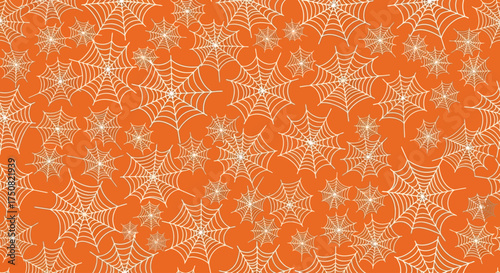 Festive Halloween background featuring a seamless repeating pattern of delicate white spider webs on a solid orange color