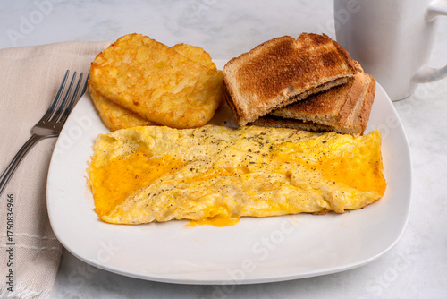 cheese omelette with  hash browns, and toast