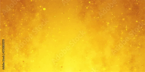 Abstract golden yellow background with small bright sparkling particles and soft light rays creating a festive and celebratory mood