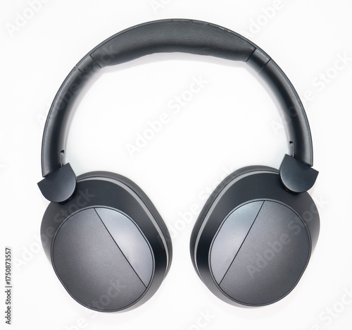 black headphones bent in photo with white background
