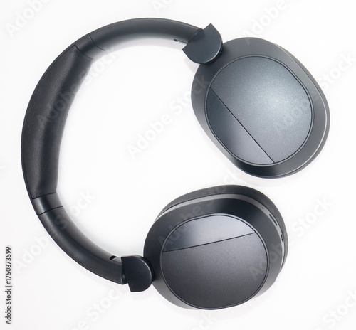 black headphones bent in photo with white background