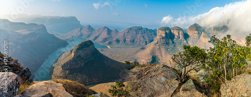 A panorama view from the rim of Blyde River Canyon towards the dam and the three Rondavels, Mpumalanga, South Africa in Springtime