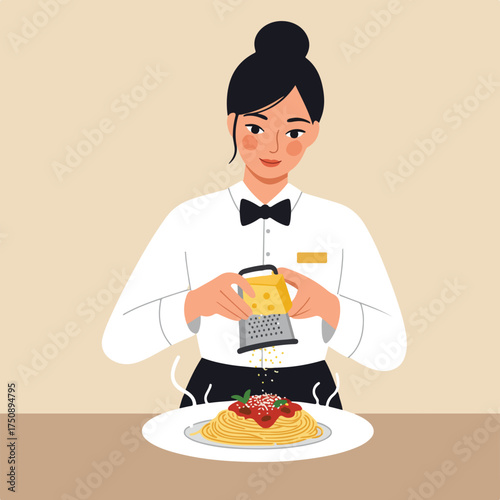 Waitress grating cheese onto pasta
