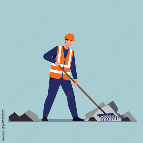 Worker cleaning rubble with rake; PPE