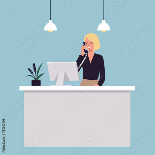 Receptionist answering phone at a desk with computer and plants