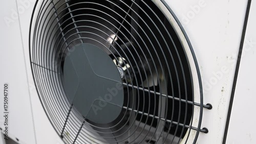 Heat pump fan spinning on an outdoor unit