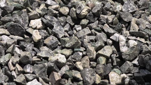 Pouring construction gravel, Rock, Stone pile, showing material handling in the construction or cement mixing process