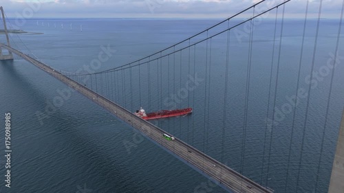 Great Belt Bridge with shipping traffic and oil tanker passing.