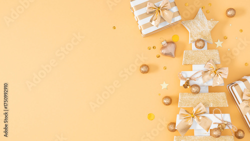 Festive background with gift boxes, glittery golden star tree, and ornaments on a warm peach background. Perfect for Christmas and New Year banners, sale promotions and festive design projects.