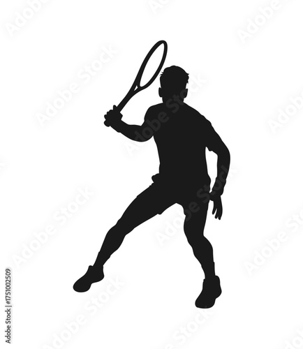 Silhouette of a male tennis player in action swinging a racket ready to hit a ball