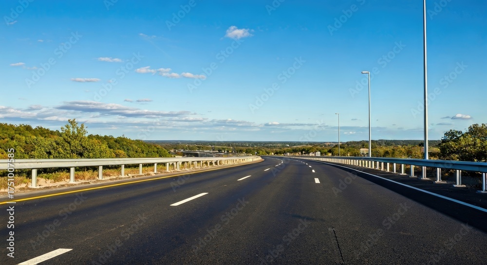 Fototapeta premium Empty highway stretches into a clear blue sky