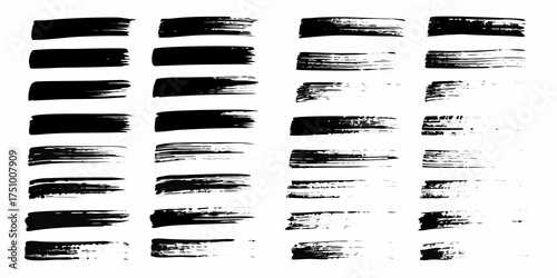 Collection of black ink brush strokes and paint splatters on white background