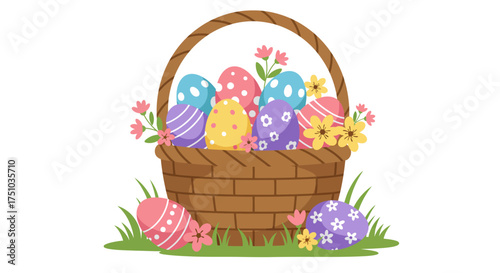 A festive wicker Easter basket filled with colorful decorated eggs and flowers sitting on green grass.