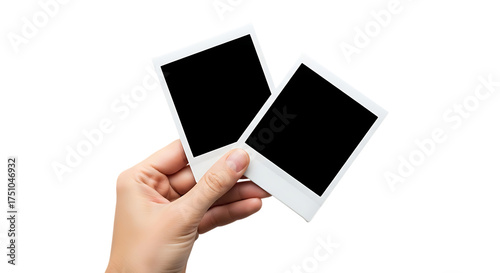Hand holding two blank instant photos memories and capturing moments