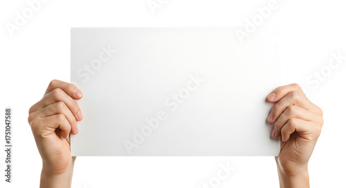Hands holding blank white paper on black background for message