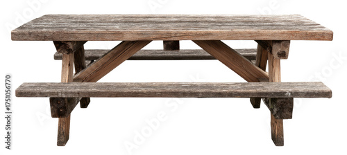A rustic, wooden picnic table, showcasing the aged grain with bench seating and support beams