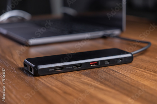 Canvas Print Black USB-C hub with multiple HDMI, USB, and PD ports connected to a laptop on a