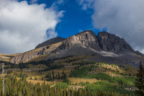 mountain cliff in morning light and shadow