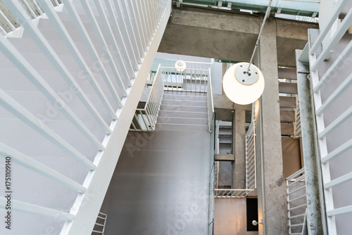 The interior and exterior architecture of Nancheng Alley Project in Tainan, Taiwan, featuring minimalist design, concrete textures, warm lighting, and a blend of modern aesthetics with traditional