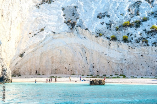 Expansive View of the Towering White Cliffs Meeting the Turquoise Sea at White Rocks Beach in Kefalonia, Greece