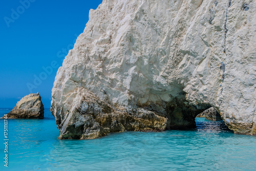 Dramatic Sea Cave and Turquoise Water at the Base of White Cliffs, Kefalonia, Greece. White rocks beach.