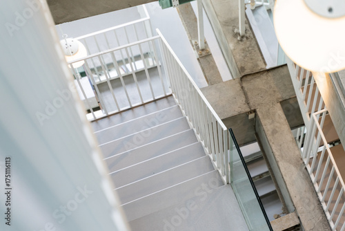 The interior and exterior architecture of Nancheng Alley Project in Tainan, Taiwan, featuring minimalist design, concrete textures, warm lighting, and a blend of modern aesthetics with traditional