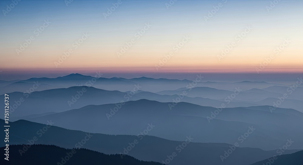 Fototapeta premium Serene Misty Mountain Ranges at Dawn Soft Horizon Glow
