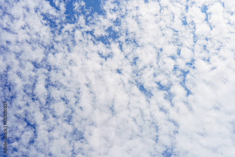 Obraz premium Cloudy blue sky abstract background, blue sky background with tiny clouds