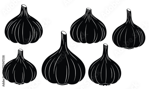Black Garlic Display: An eye-level close-up of several bulbous heads of black garlic, showcasing its unique texture and rich color, arranged in an organized display.