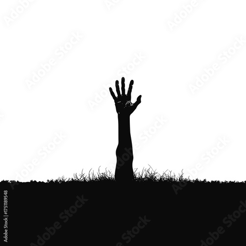 Creepy zombie hand silhouette emerging from the grave in soil