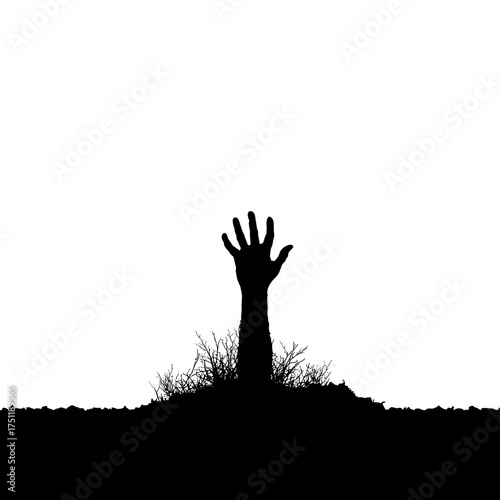 Zombie hand silhouette rising from ground with grass isolated on white background