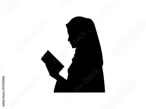 vector silhouette of a girl wearing a hijab reading a book isolated on white background 
