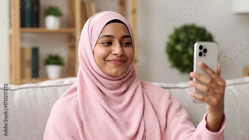 Happy Muslim Woman Making Video Call on Mobile Phone